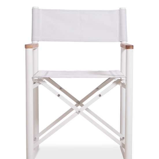 A white Aleta director chair, made from a white aluminum frame, white fabric and teak armrests.