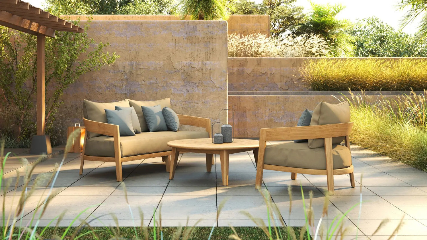 Outdoor lounge set with sofa, chair, & coffee table on a patio surrounded by plants by Be A Little.