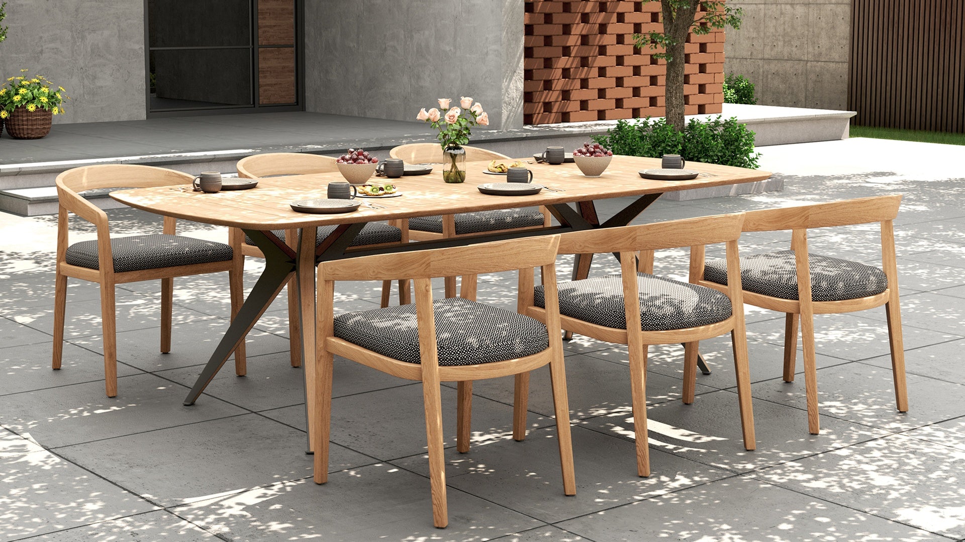 Outdoor dining set with a rectangular wooden table & 6 dining chairs with gray cushions on a patio.