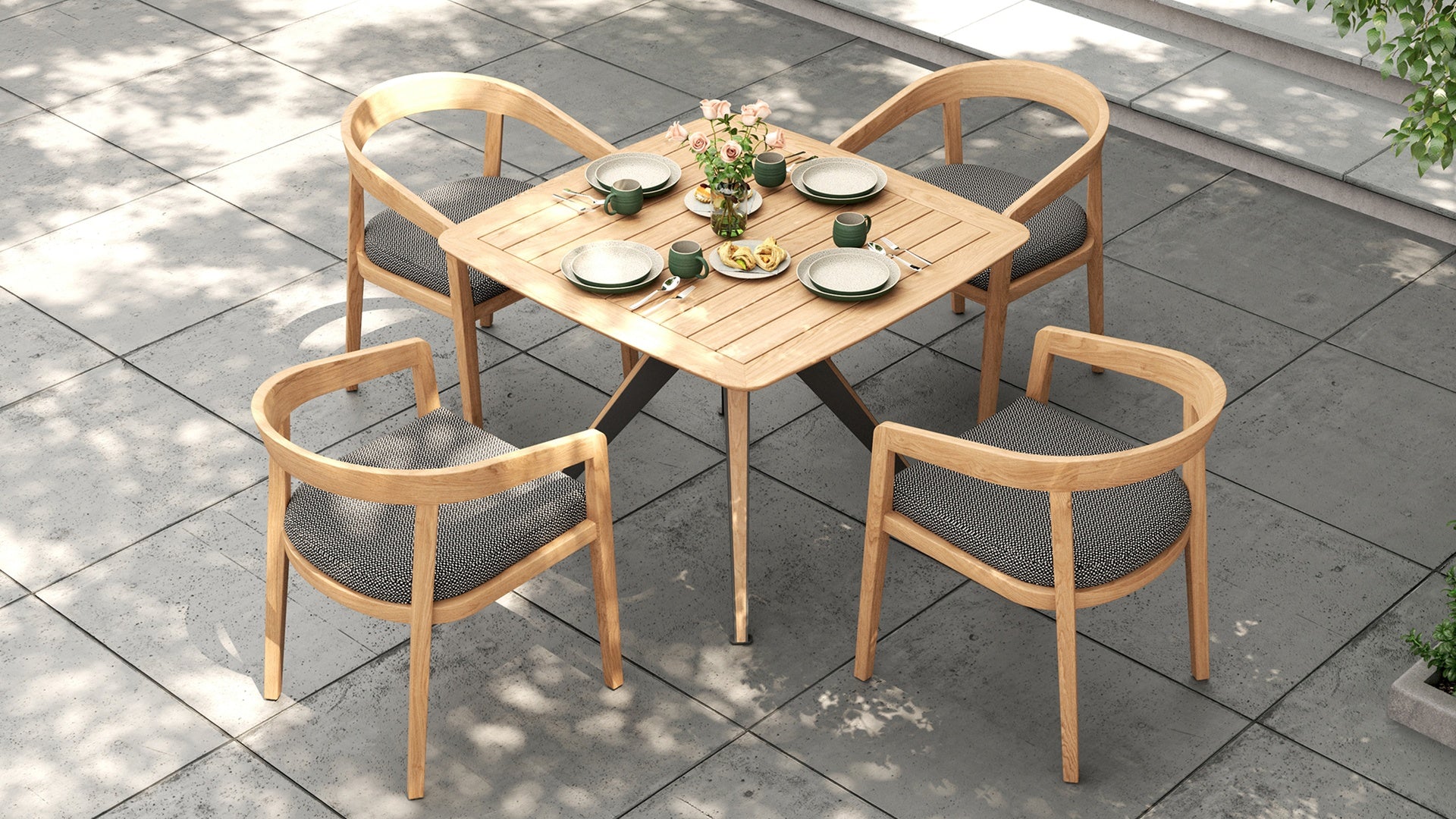 Overhead view of a small square outdoor dining set with a gray pattern on the outdoor dining chairs.
