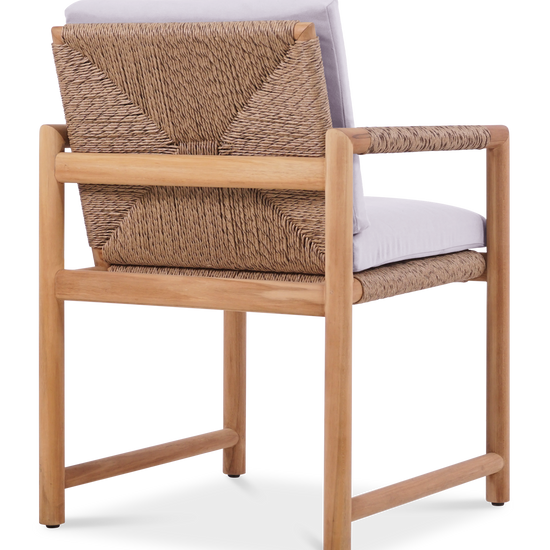 Rear view of the Timo dining armchair with rope-wrapped backrest, teak frame, and white cushions.